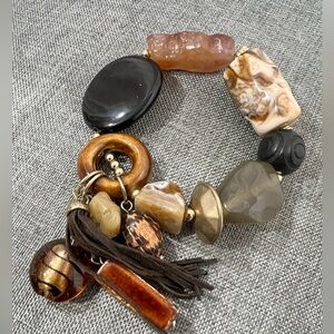 Acrylic And Glass Beads With a Leather Tassel All in Brown And Gold Warm Tones.